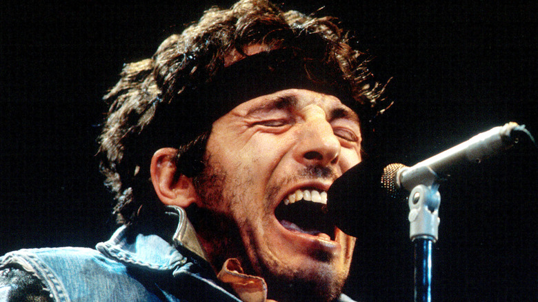 Bruce Springsteen in '80s singing onstage with eyes closed