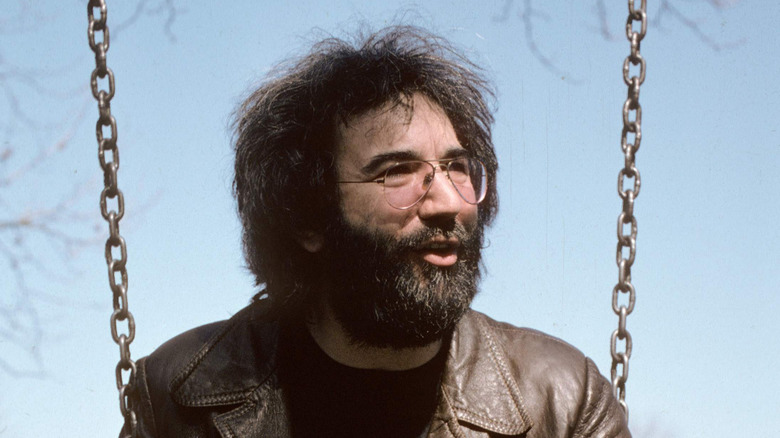 Jerry Garcia talking on a swing