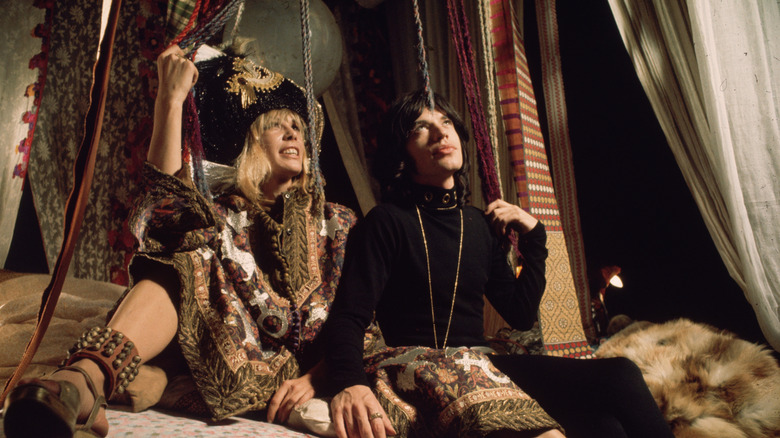 mick jagger and anita pahlenberg in a scene from performance