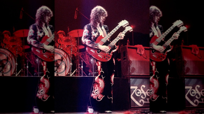 Jimmy Page wearing dragon suit and playing double guitar at 1975 concert