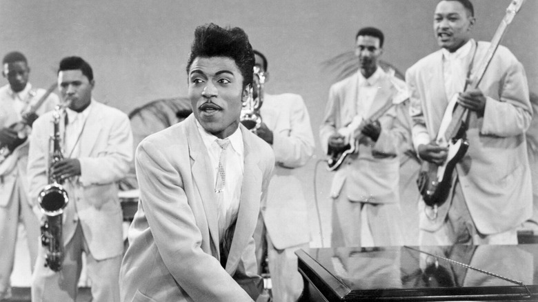 Little Richard playing piano with band, 1956