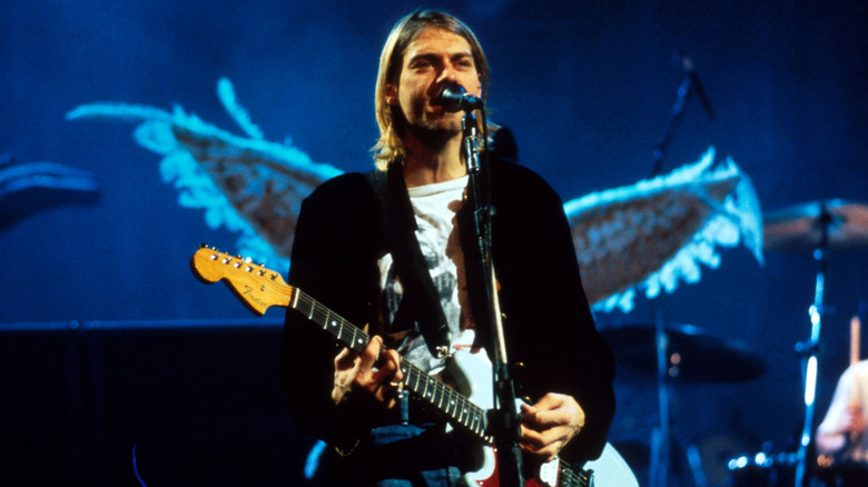 Kurt Cobain performing on stage