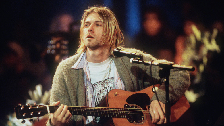 Kurt Cobain onstage with acoustic guitar