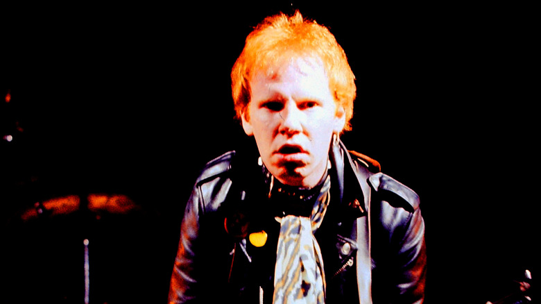 Cheetah Chrome on stage glaring at the crowd.