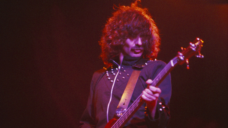 Geezer Butler onstage playing guitar