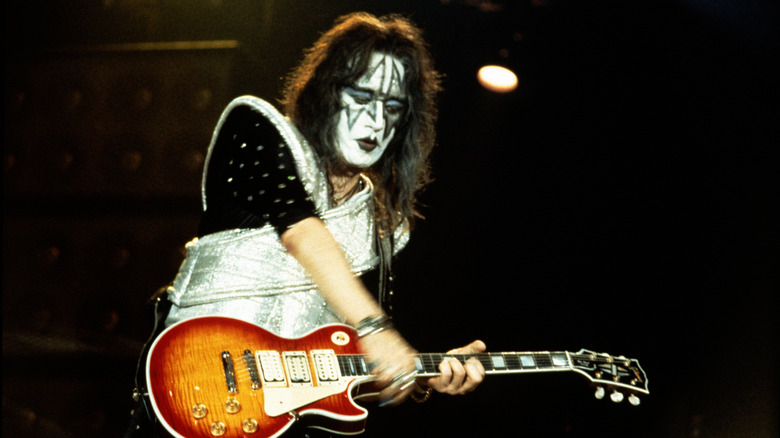 Ace Frehley playing guitar with KISS