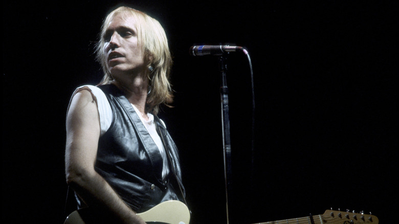 Tom Petty onstage with a guitar