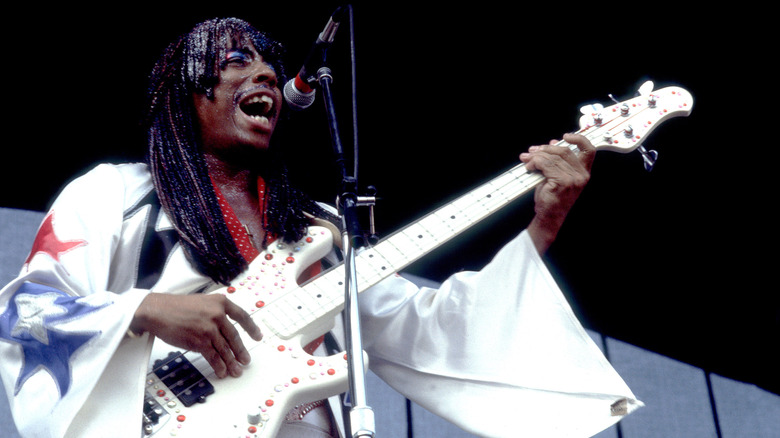 Rick James playing his bass on stage in 1980.
