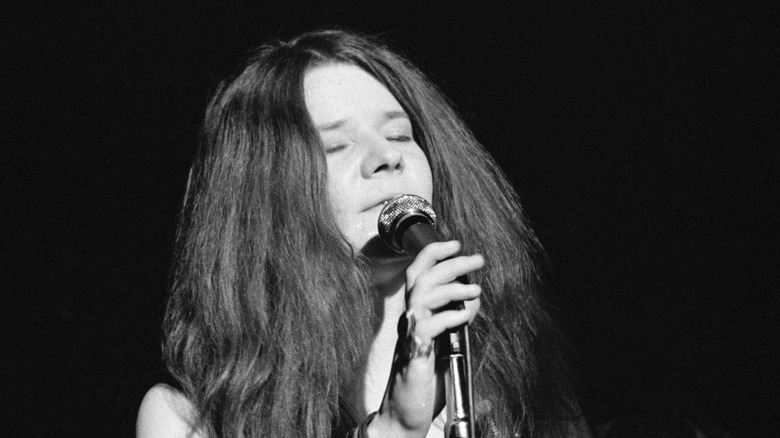 Janis Joplin singing with her eyes closed