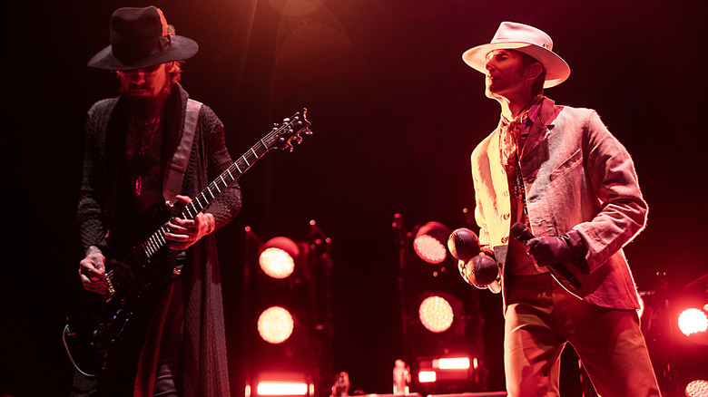 Jane's Addiction's Dave Navarro and Perry Farrell playing on stage in 2024