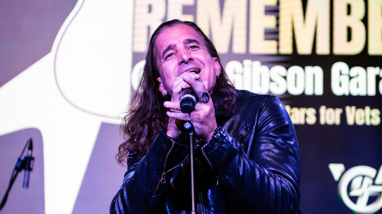 Scott Stapp singing into a microphone
