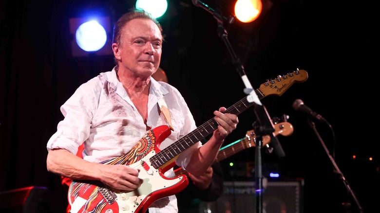 David Cassidy playing guitar