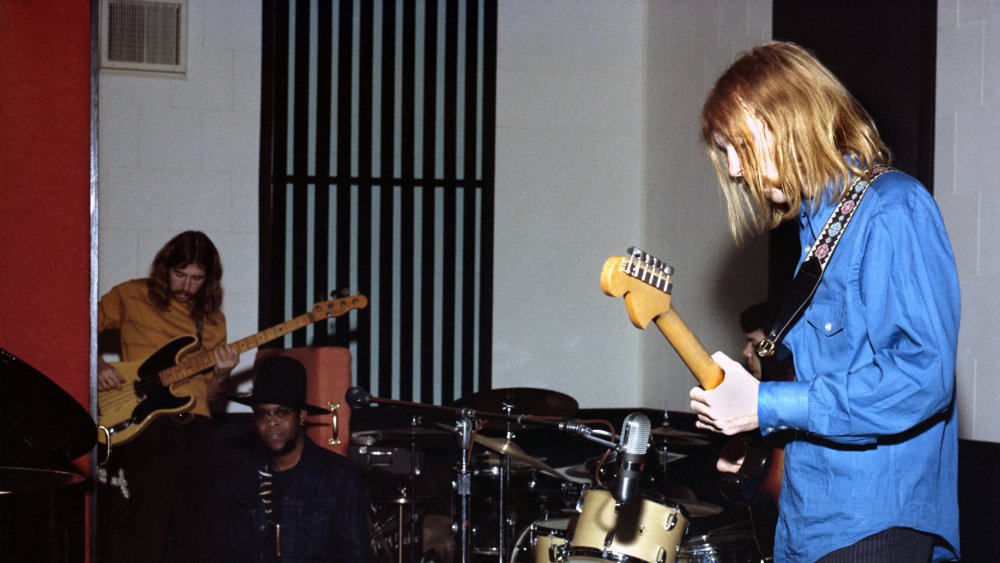 Duane Allman (foreground in blue) and Berry Oakley (background in yellow))