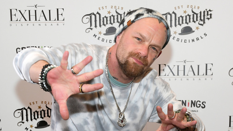 Five Finger Death Punch's Ivan Moody poses at 2022 event