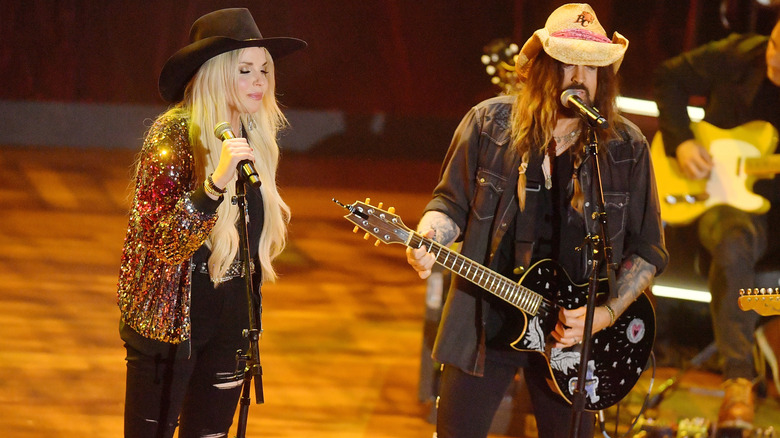 Firerose and Billy Ray Cyrus performing onstage