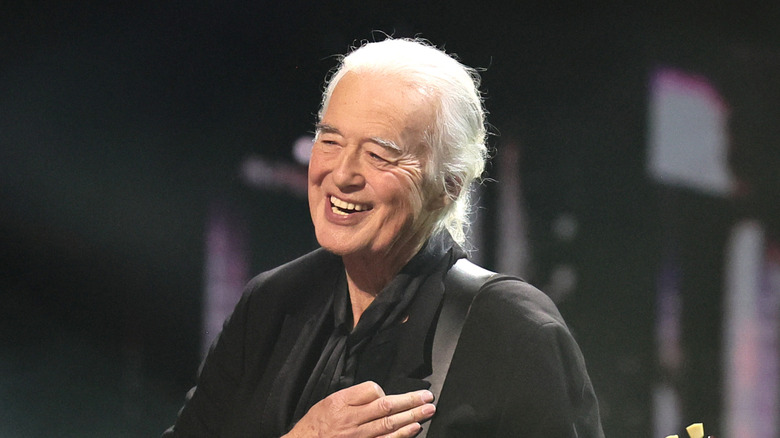 Jimmy Page performs at a concert