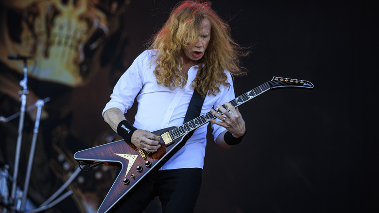 Dave Mustaine playing guitar on stage
