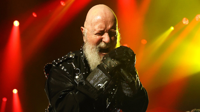 Singer Rob Halford on stage in leather jacket