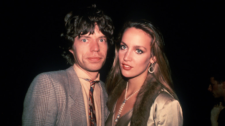 The Rolling Stones' Mick Jagger and Jerry Hall posing for a photo