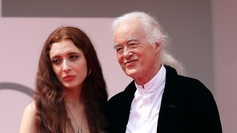 Scarlett Sabet and Led Zeppelin's Jimmy Page posing for a photo