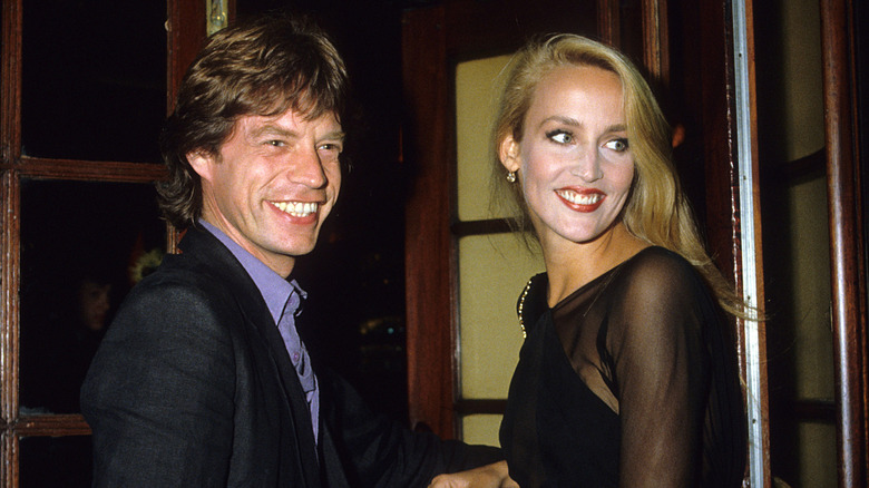 The Rolling Stones' Mick Jagger and Jerry Hall smiling