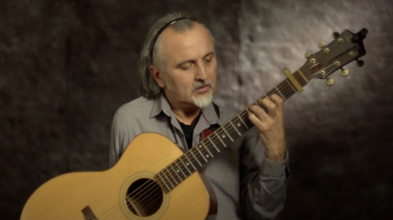 Andres Godoy playing guitar