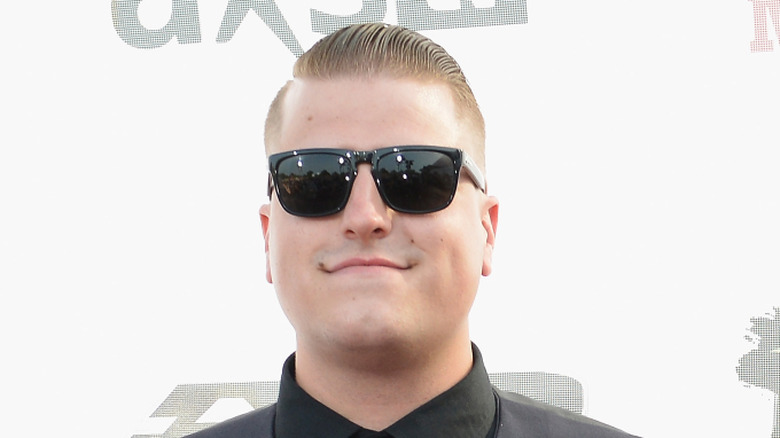 Andrew Tkaczyk smiling in sunglasses