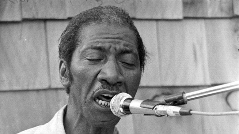 Hound Dog Taylor singing with eyes closed