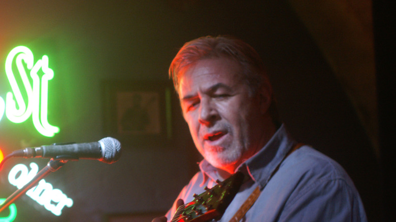 Jim Byrnes singing and playing guitar