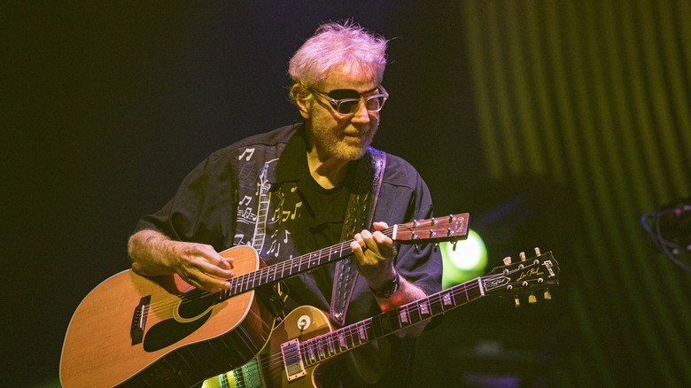 Richard Williams of Kansas playing guitar