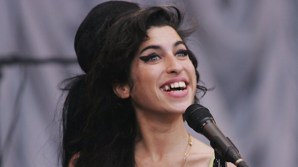 Amy Winehouse in front of microphone