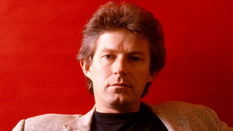 publicity photo of Don Henley with red background