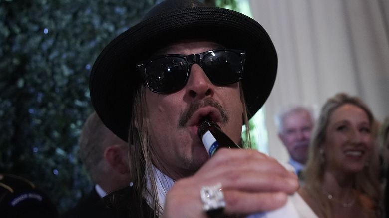 Kid Rock drinking a beer at the presidential inauguration