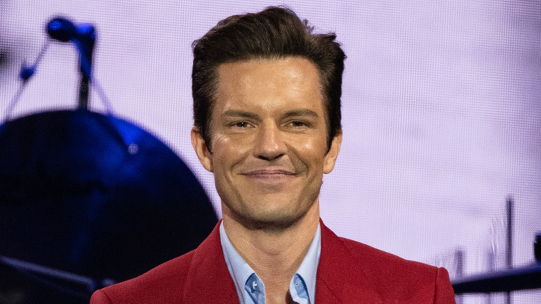 Brandon Flowers smirking onstage