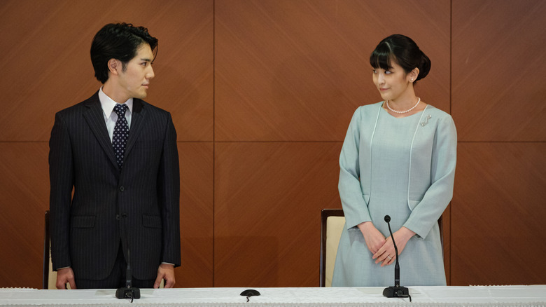Princess Mako looks at her husband after announcing their marriage