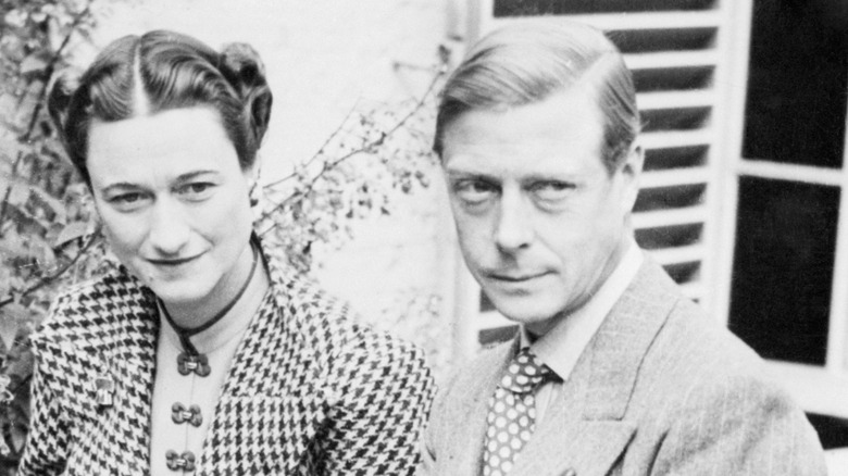 The Duke and Duchess of Windsor sitting outside a house