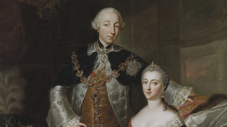 Portrait of Peter iii stood and Catherine the Great sat in fancy clothing