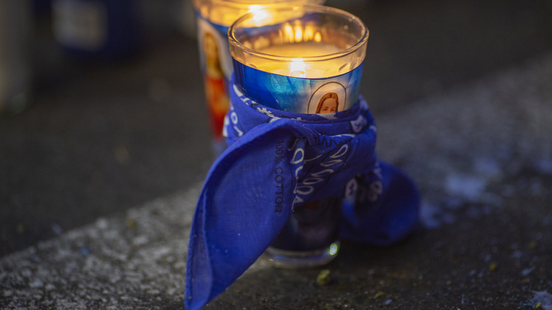 blue bandana tied around candle