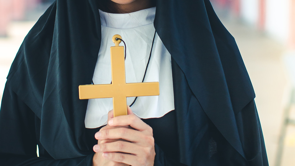 Nun holding a cross