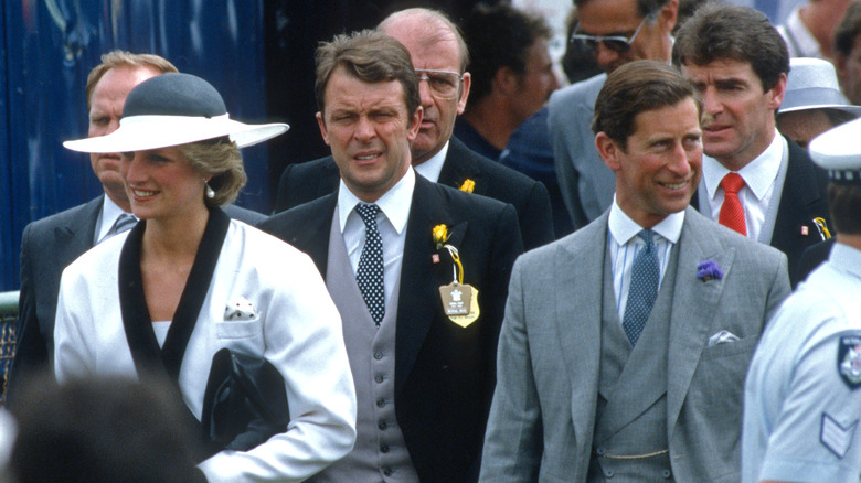 Prince Charles and Princess Diana with bodyguards