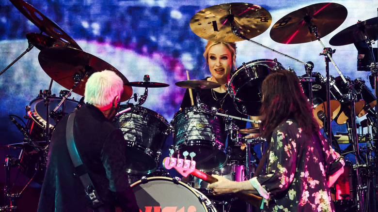 Geddy Lee and Alex Lifeson playing with Anika Nilles
