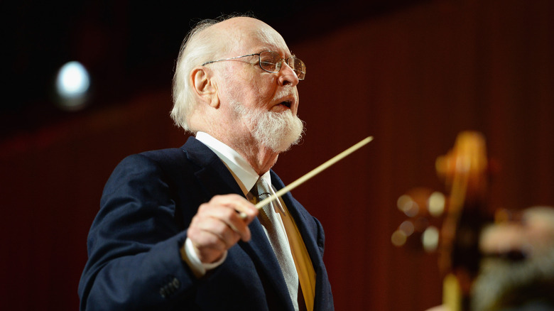 John Williams conducting an orchestra