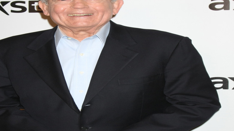 Dan Rather smiling big at Axs TV event