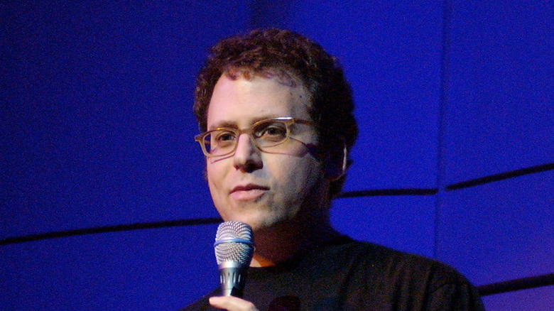 Stephen Glass holding microphone on stage