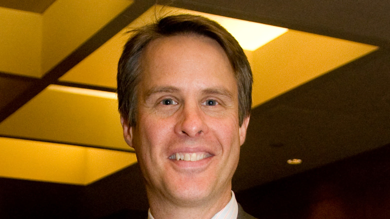 Terry Moran smiling in suit
