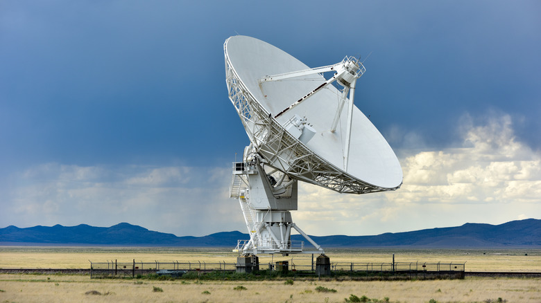 large satellite dish in a field