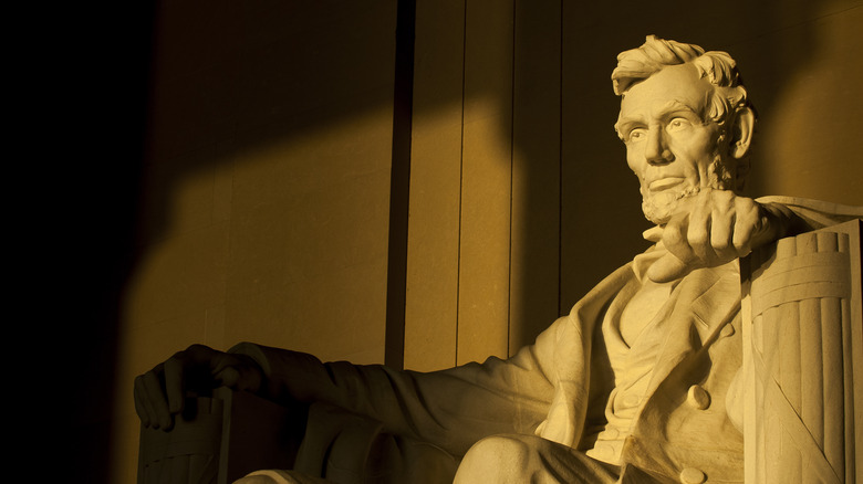 Statue of Abraham Lincoln in brilliant warm morning dramatic sunlight