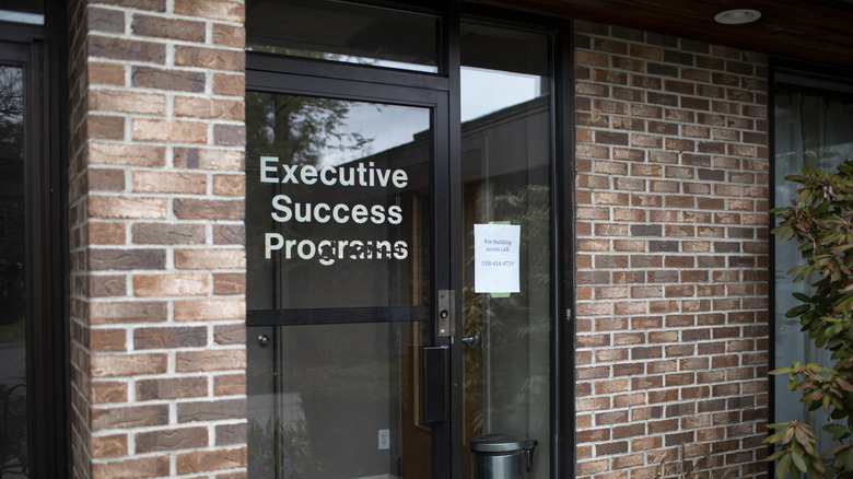 former NXIVM office brick building glass door