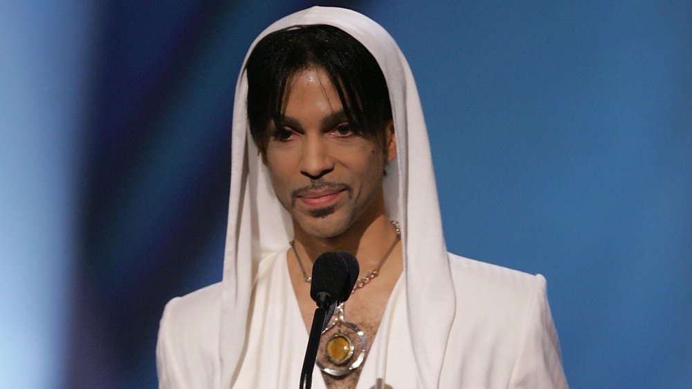 Prince with white hoodie on stage