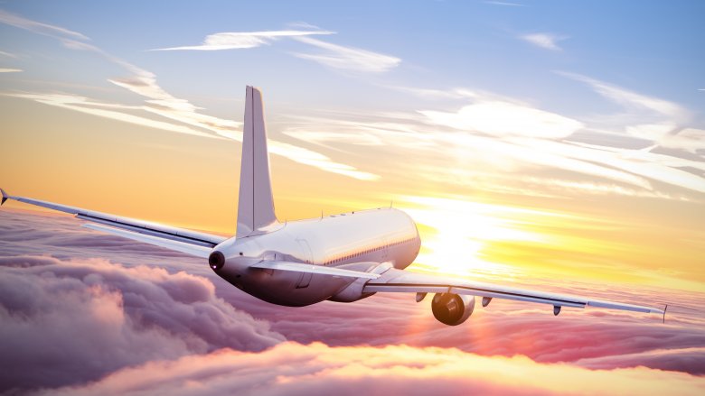 airplane flying clouds